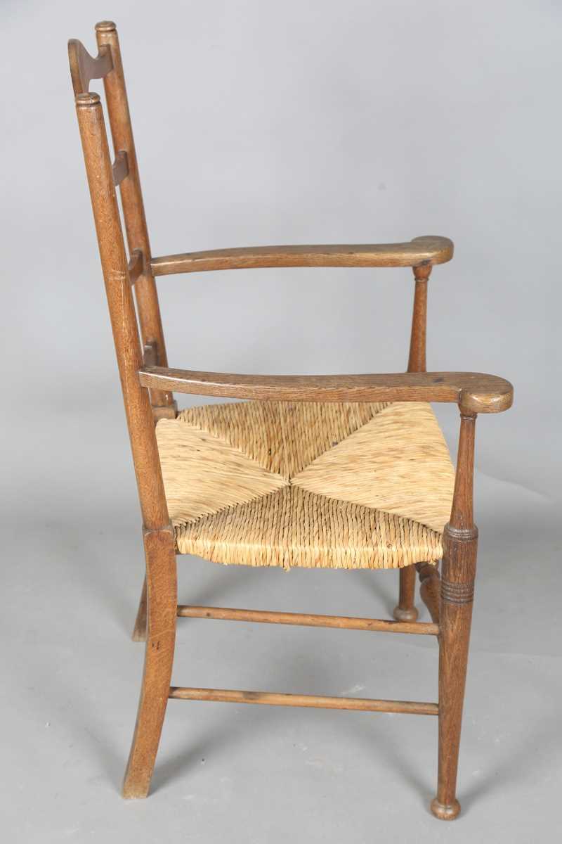 An Edwardian Arts and Crafts oak framed elbow chair, in the manner of William Birch, height 107cm, - Image 5 of 8