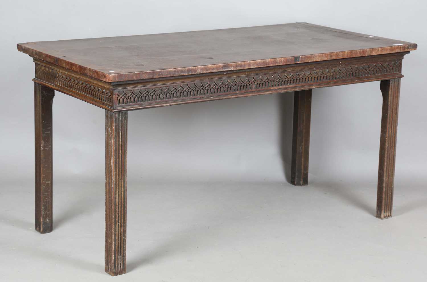 A George III mahogany serving table, the crossbanded top above a blind fretwork frieze, on channel