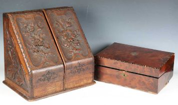 A late Victorian oak slope-front stationery box, carved with leaves and flowers, height 37cm,