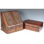 A late Victorian oak slope-front stationery box, carved with leaves and flowers, height 37cm,