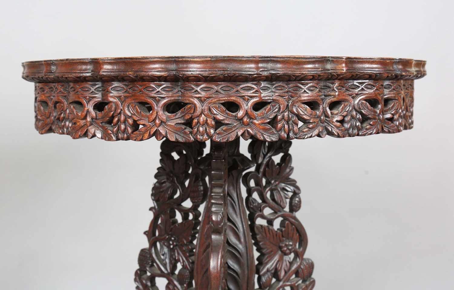 A 19th century Burmese hardwood centre table, the shaped circular top above a tripod support of - Image 3 of 13
