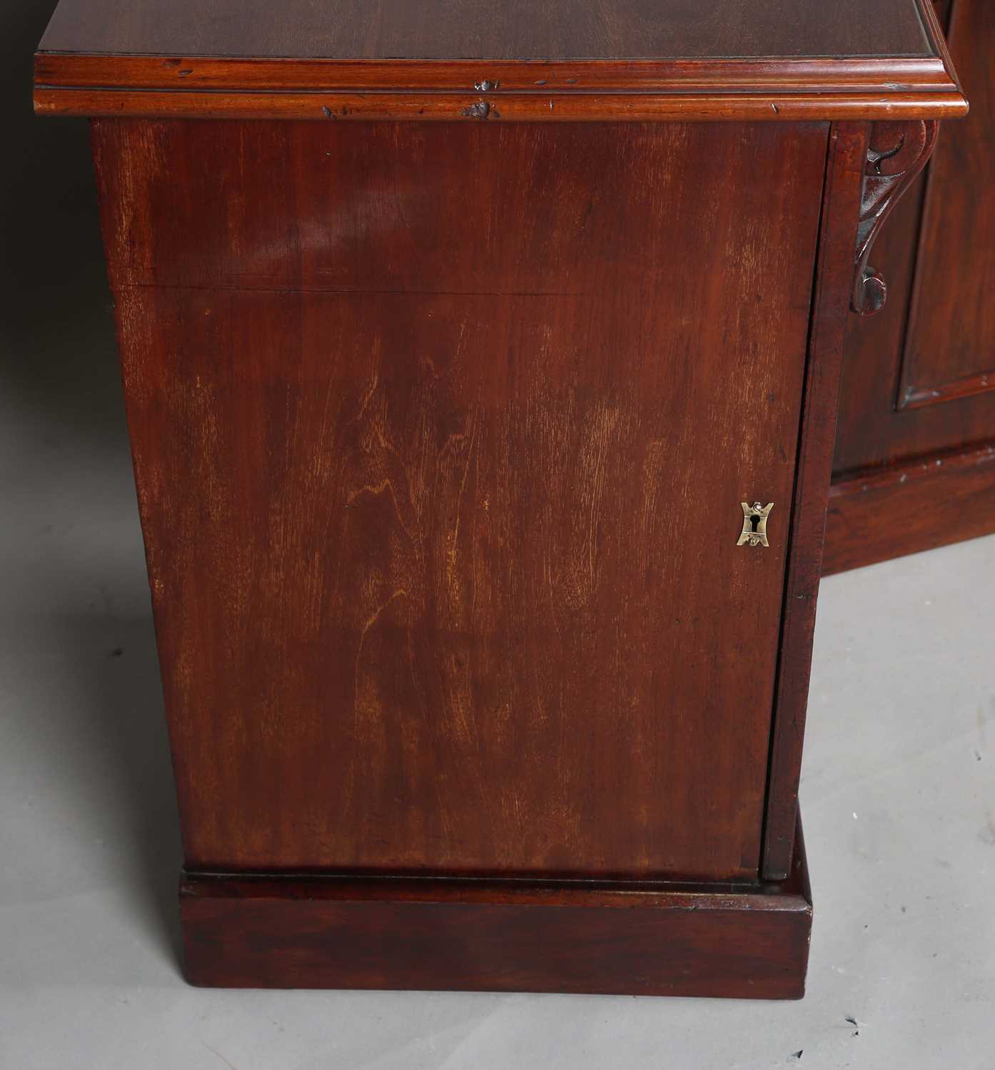 A pair of Victorian and later mahogany pedestal cabinets, each fitted with an arched panel door, - Image 4 of 10