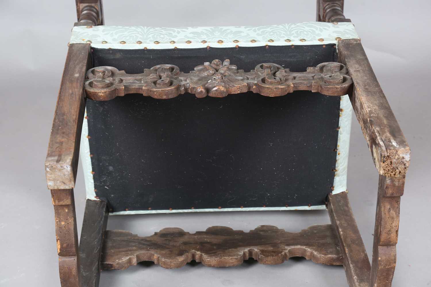 A late 17th century Continental walnut armchair, the finials carved with masks, the two front legs - Image 15 of 15