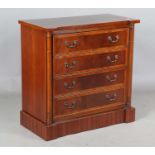 A late 20th century reproduction mahogany chest of drawers, crossbanded in yew, the four long