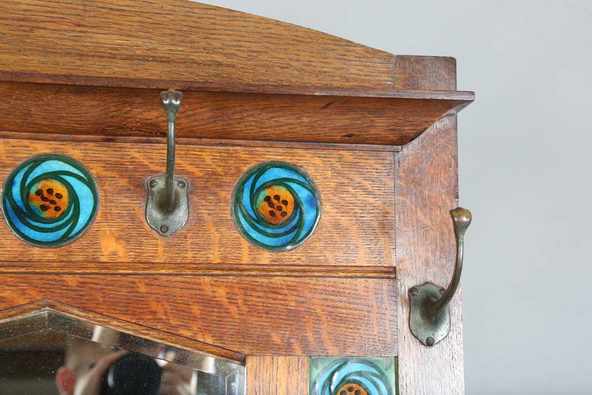 An Edwardian Arts and Crafts Glasgow School oak hallstand, the mirrored back inset with glazed - Image 3 of 13