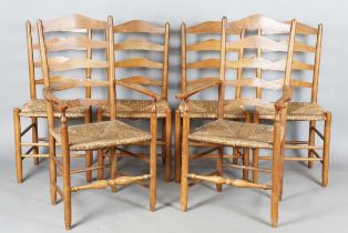 A set of six early 20th century Arts and Crafts ash framed ladder back chairs, in the manner of