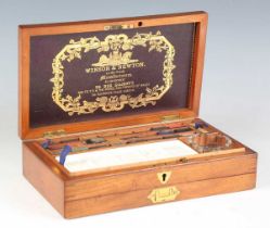 A late Victorian mahogany cased artist's box by Winsor & Newton, 'By Appointment to Her Majesty',