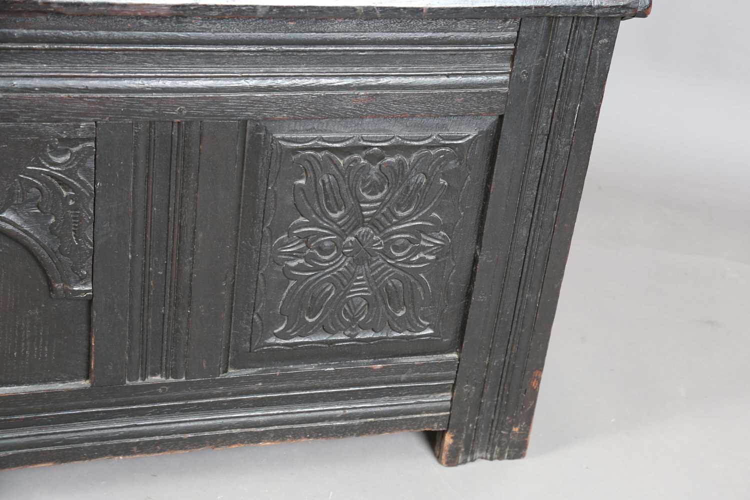 An 18th century panelled oak coffer with a domed lid and carved front, height 61cm, width 125cm, - Image 8 of 12