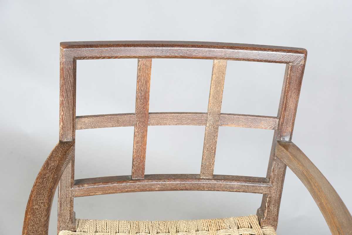 An early 20th century Cotswold School limed oak low elbow chair with woven string seat, height 70cm, - Image 2 of 10