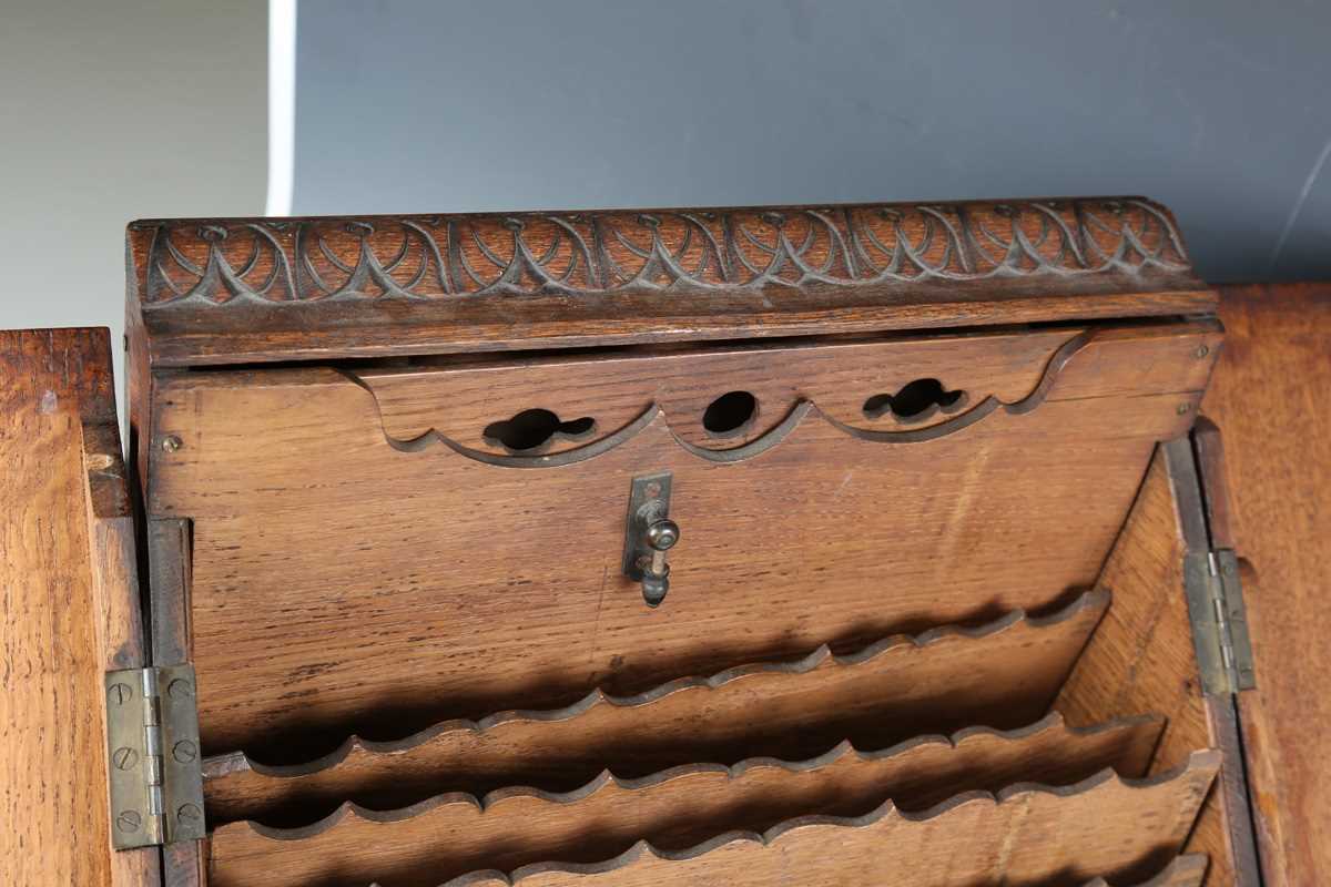 A late Victorian oak slope-front stationery box, carved with leaves and flowers, height 37cm, - Image 3 of 16