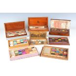 A group of eight mainly 19th century artists' boxes, including one with transfer printed sliding top