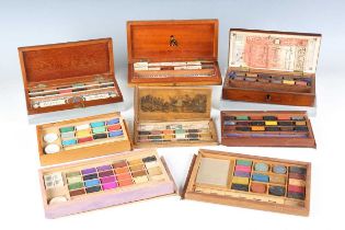 A group of eight mainly 19th century artists' boxes, including one with transfer printed sliding top