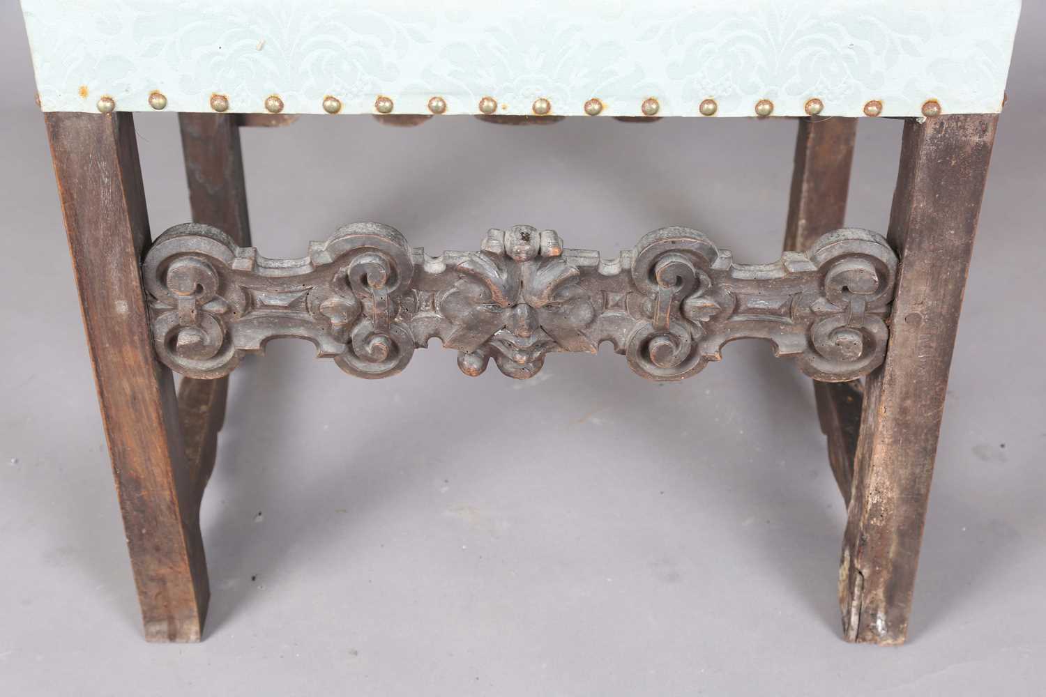 A late 17th century Continental walnut armchair, the finials carved with masks, the two front legs - Image 6 of 15