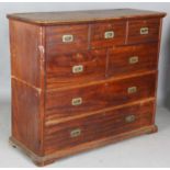 A 19th century colonial camphor campaign style chest of drawers with brass recessed handles,