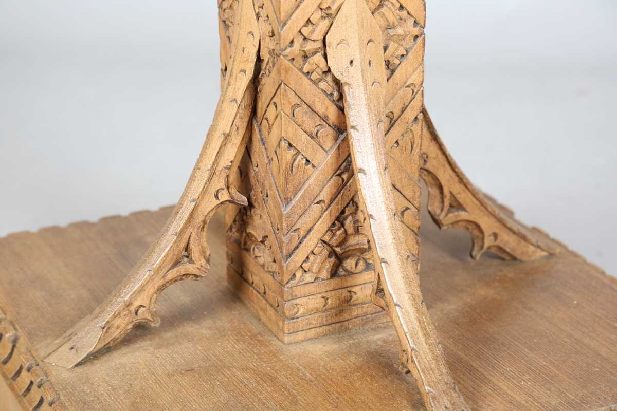 A 20th century Arts and Crafts style carved softwood centre table, the top decorated with wheat - Image 7 of 10