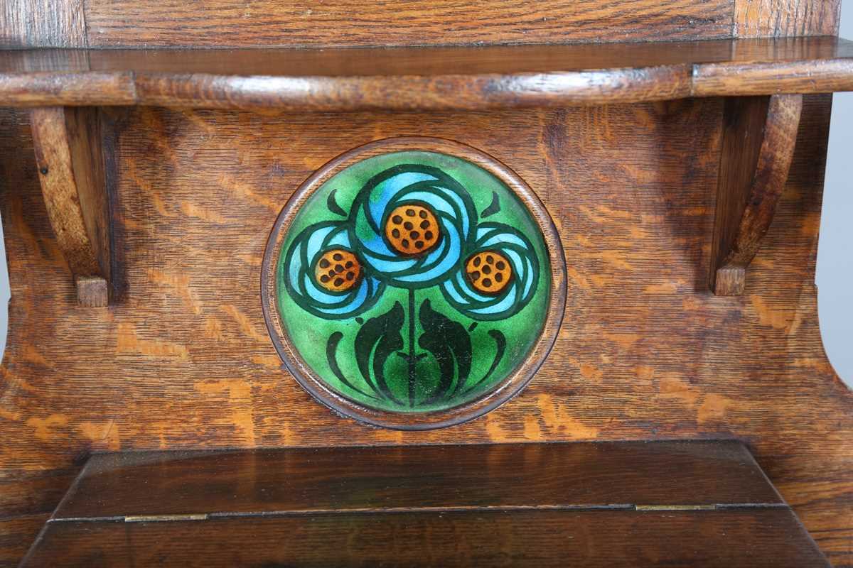 An Edwardian Arts and Crafts Glasgow School oak hallstand, the mirrored back inset with glazed - Image 9 of 13