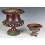 A late Victorian painted cast iron garden urn of half-reeded campana form, height 32cm, together