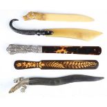 A late 19th century horn paperknife with brass lizard head handle, length 26cm, together with a