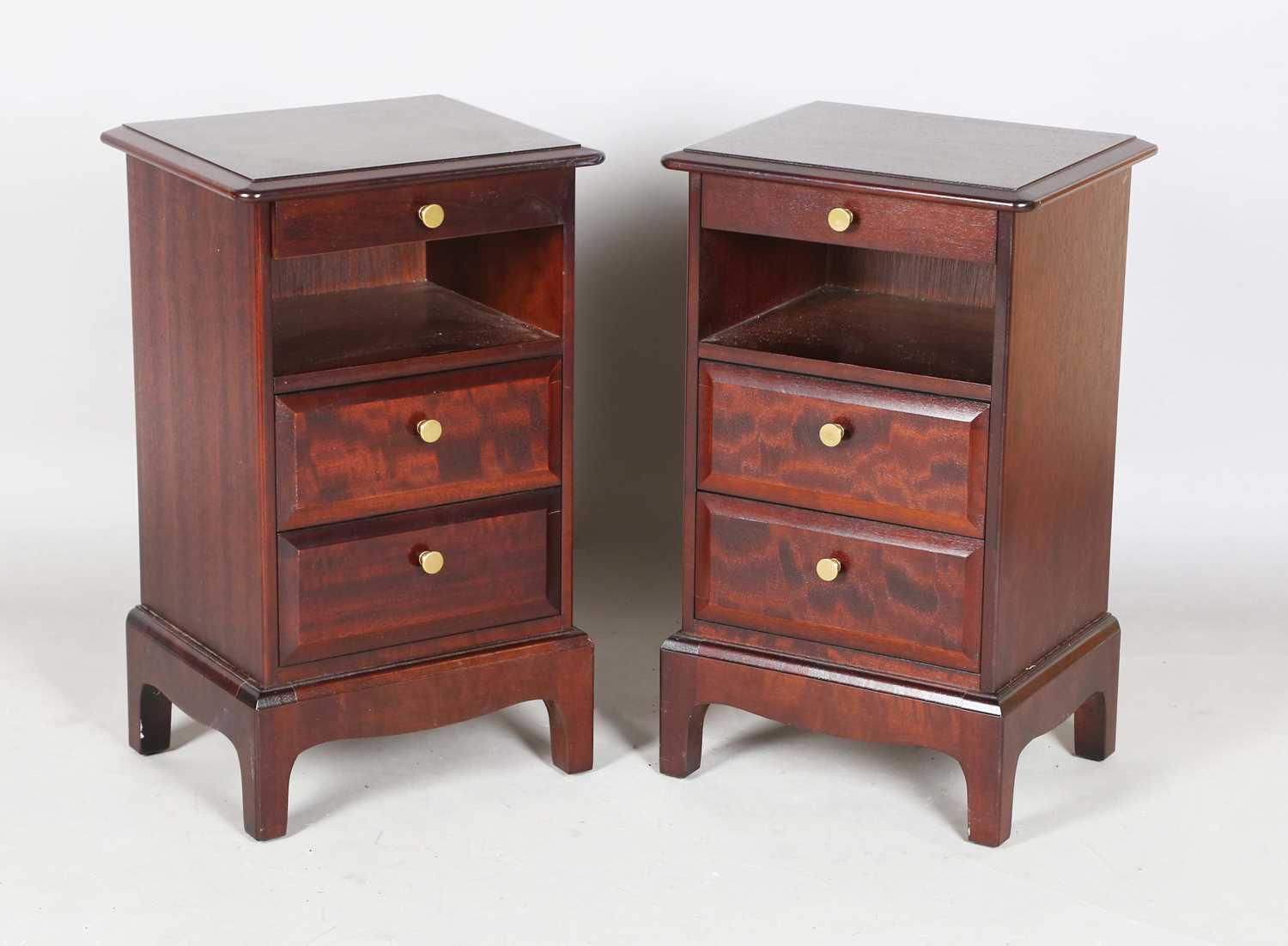 A pair of late 20th century Stag hardwood bedside chests, each with slide, open shelf and two