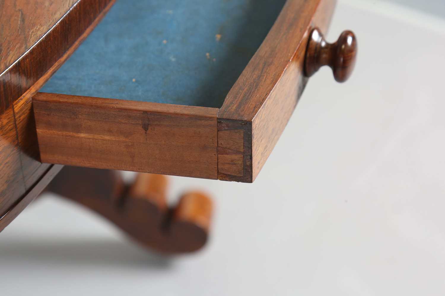 An early Victorian rosewood oval library table, fitted with opposing drawers, on octagonal - Image 3 of 10