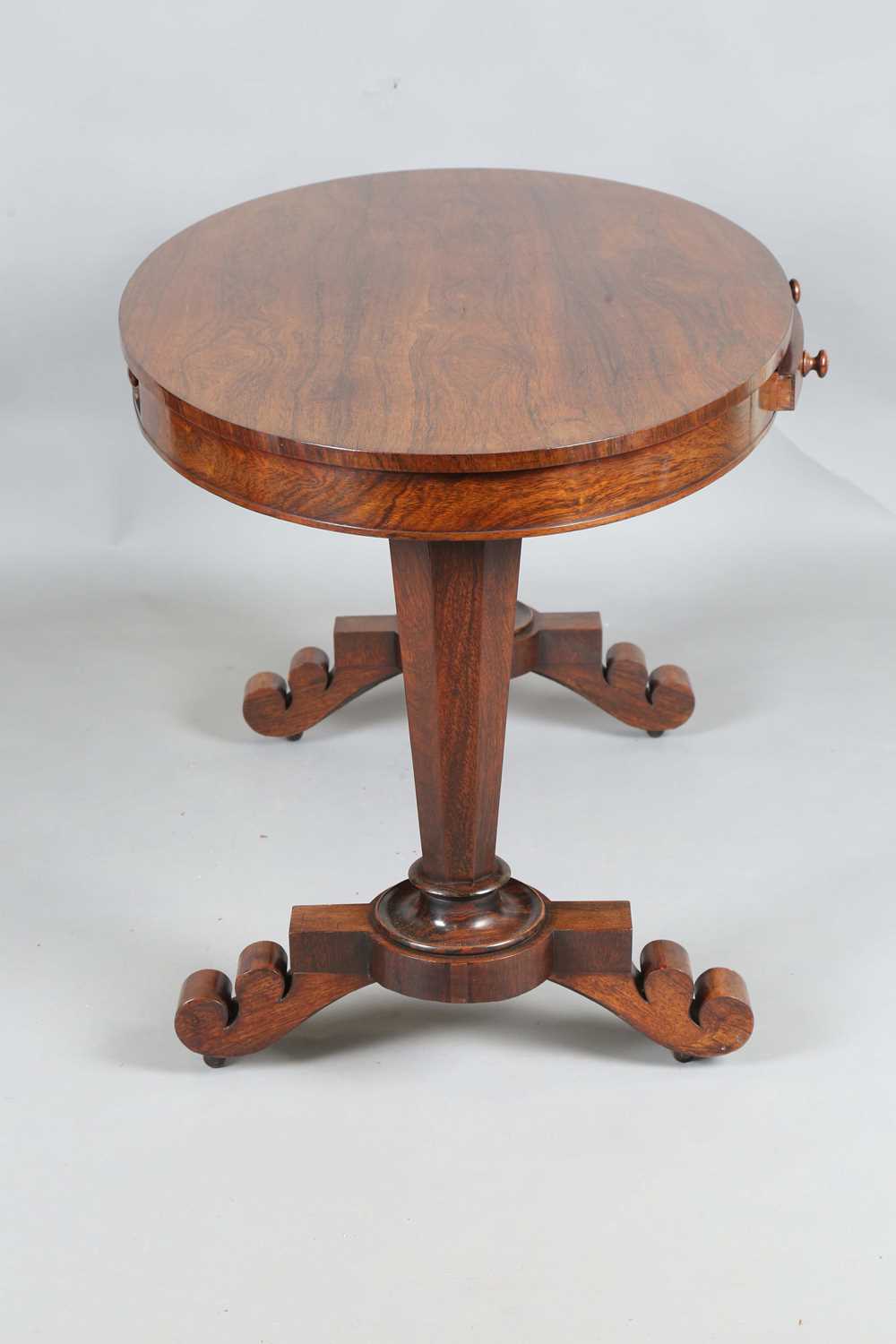 An early Victorian rosewood oval library table, fitted with opposing drawers, on octagonal - Image 7 of 10