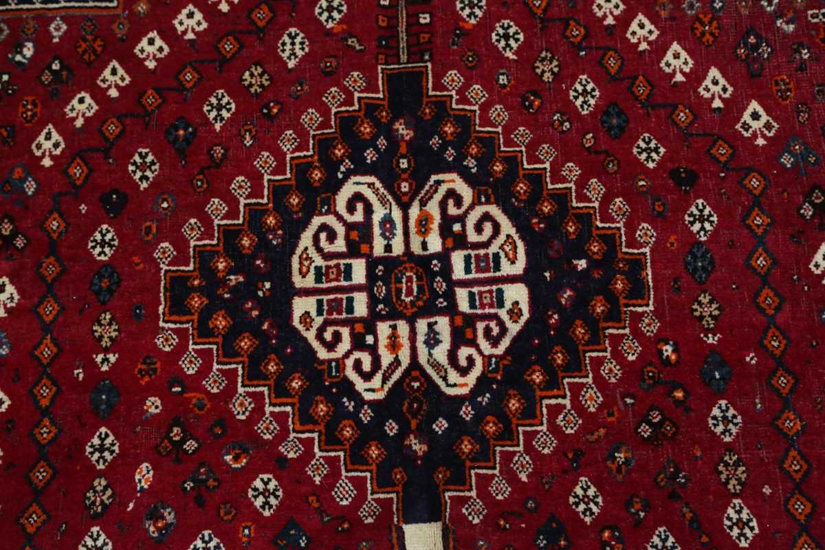 A Ghashghai rug, South-west Persia, late 20th century, the red field with three linked medallions, - Image 4 of 7