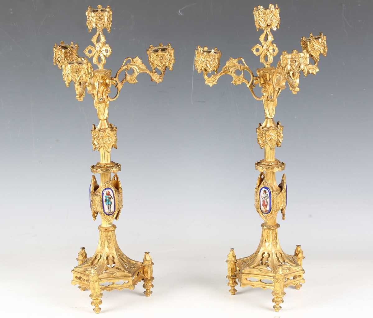 A pair of late 19th century French Gothic Revival cast ormolu four-light candelabra, each stem