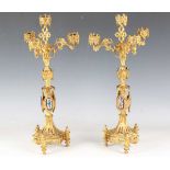 A pair of late 19th century French Gothic Revival cast ormolu four-light candelabra, each stem