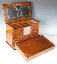 A Victorian burr walnut stationery cabinet writing box by Parkins & Gotto of London, the hinged