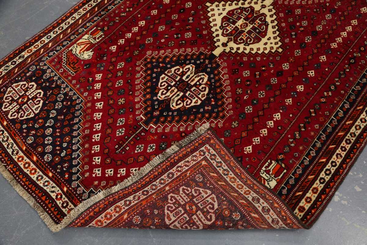 A Ghashghai rug, South-west Persia, late 20th century, the red field with three linked medallions, - Image 7 of 7