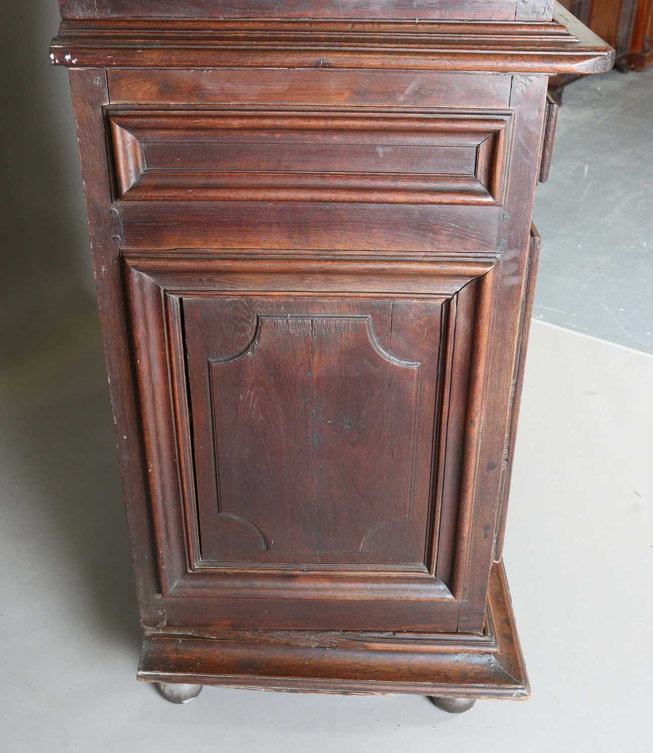 A large 18th century Continental oak cupboard, fitted with four panelled doors and two drawers, - Image 11 of 17