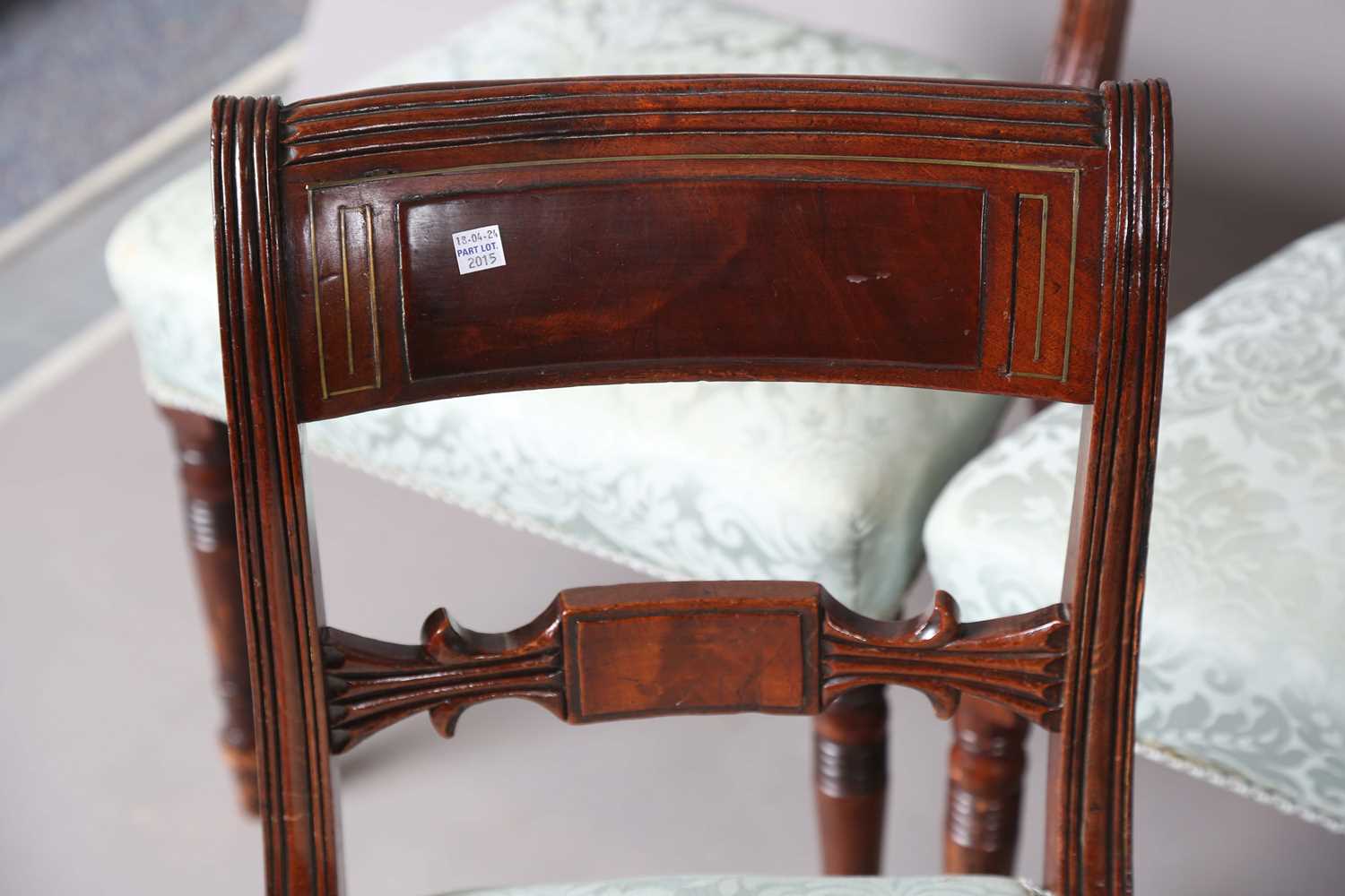 A set of eight Regency mahogany and brass inlaid bar back dining chairs, comprising two carvers, - Image 14 of 17