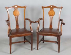A set of eight Edwardian mahogany pierced splat back dining chairs, the backs inlaid with scallop