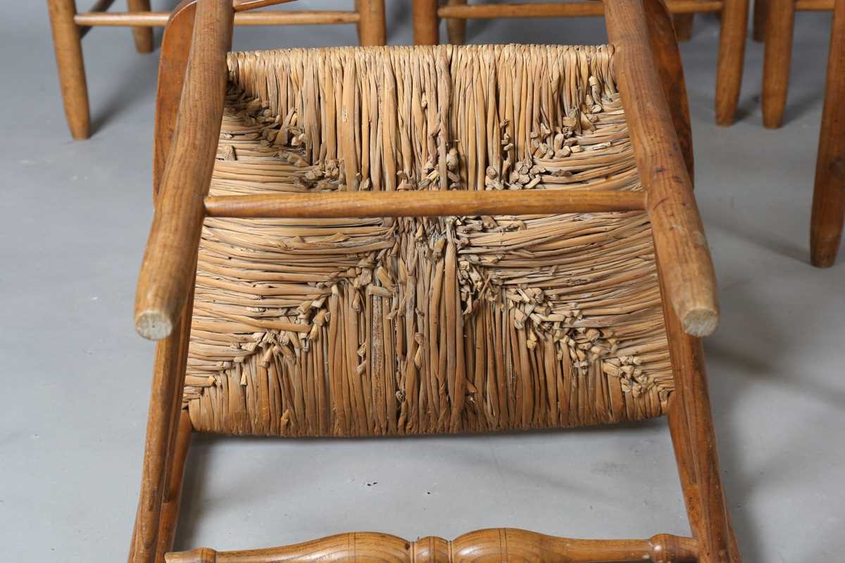 A set of six early 20th century Arts and Crafts ash framed ladder back chairs, in the manner of - Image 10 of 15