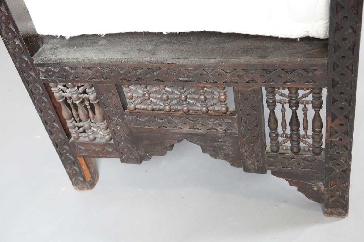 An early 20th century Middle Eastern softwood daybed, similar to those retailed by Liberty & Co, - Image 10 of 15