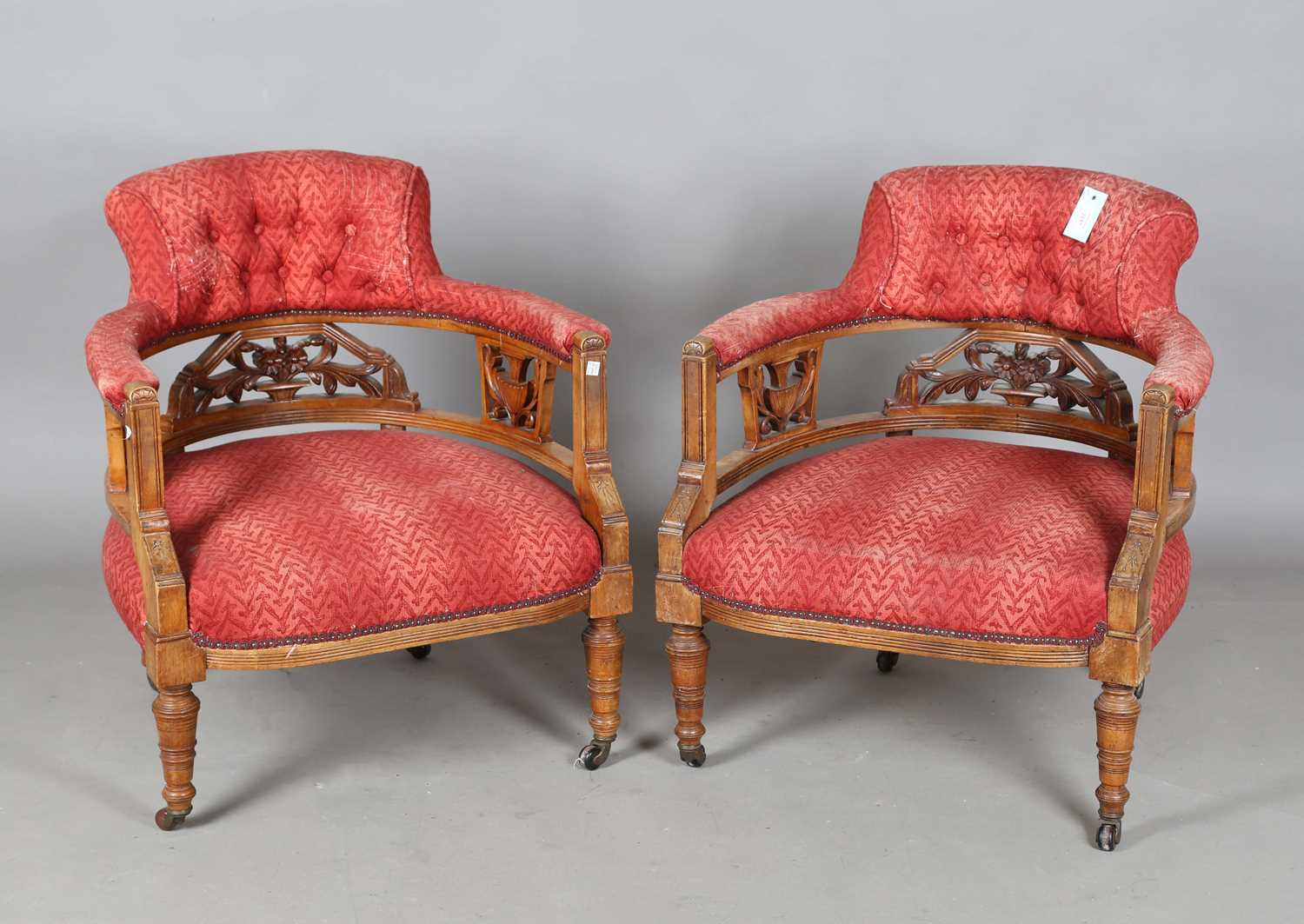 A pair of late Victorian Aesthetic Movement walnut framed tub back salon chairs, height 75cm,