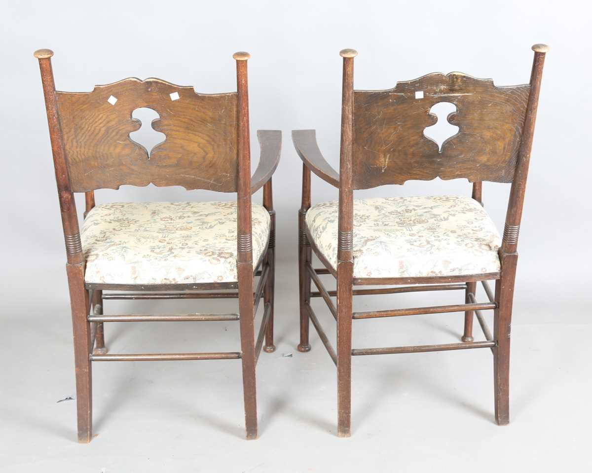 A pair of early 20th century Arts and Crafts oak and ash framed elbow chairs, in the manner of - Image 11 of 12