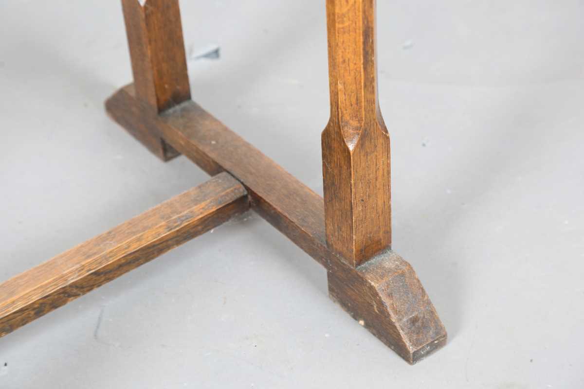 An early 20th century Arts and Crafts style oak canted rectangular occasional table, raised on - Image 4 of 6