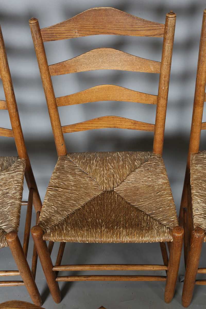 A set of six early 20th century Arts and Crafts ash framed ladder back chairs, in the manner of - Image 13 of 15