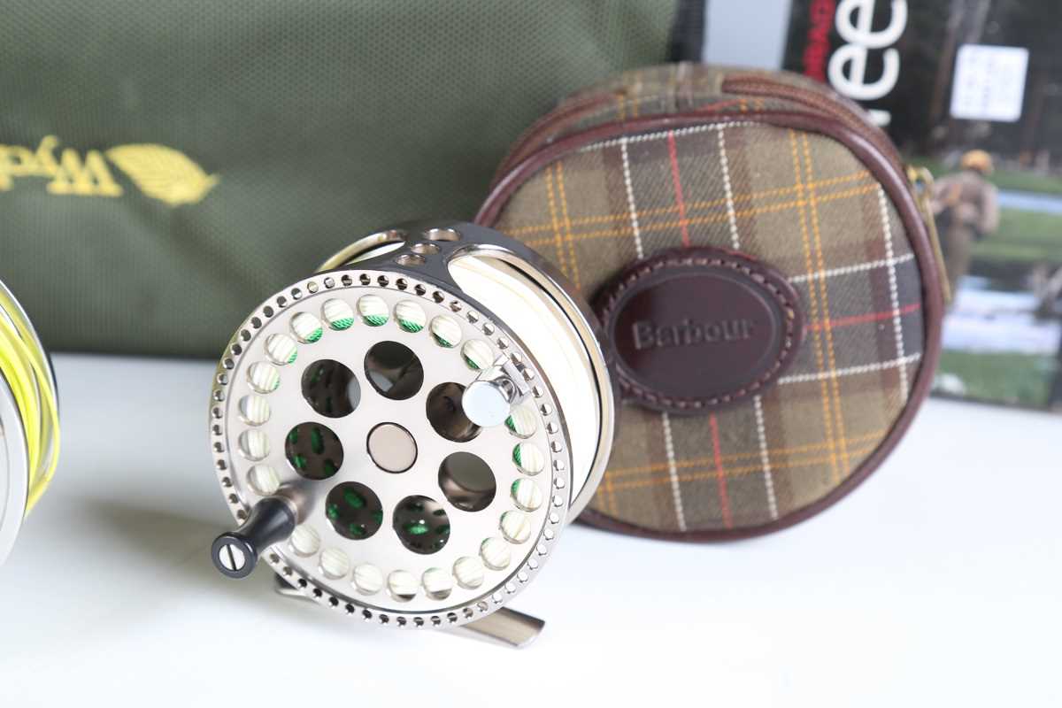 A group of five modern fly fishing reels, including a Hardy 'Uniqua' 5/6, diameter 9cm, boxed, an - Image 2 of 10