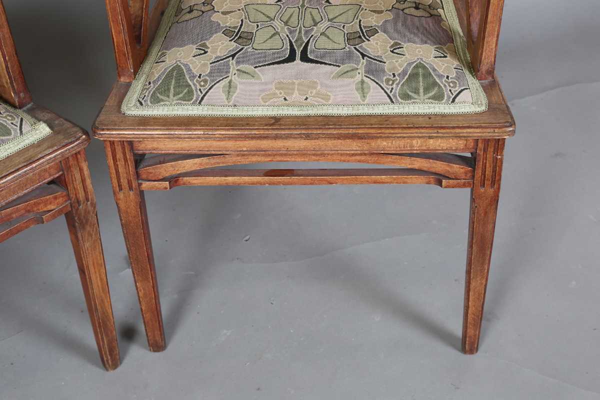 An Art Nouveau stained beech three-piece salon suite with pierced showframe and contemporary fabric, - Image 23 of 27