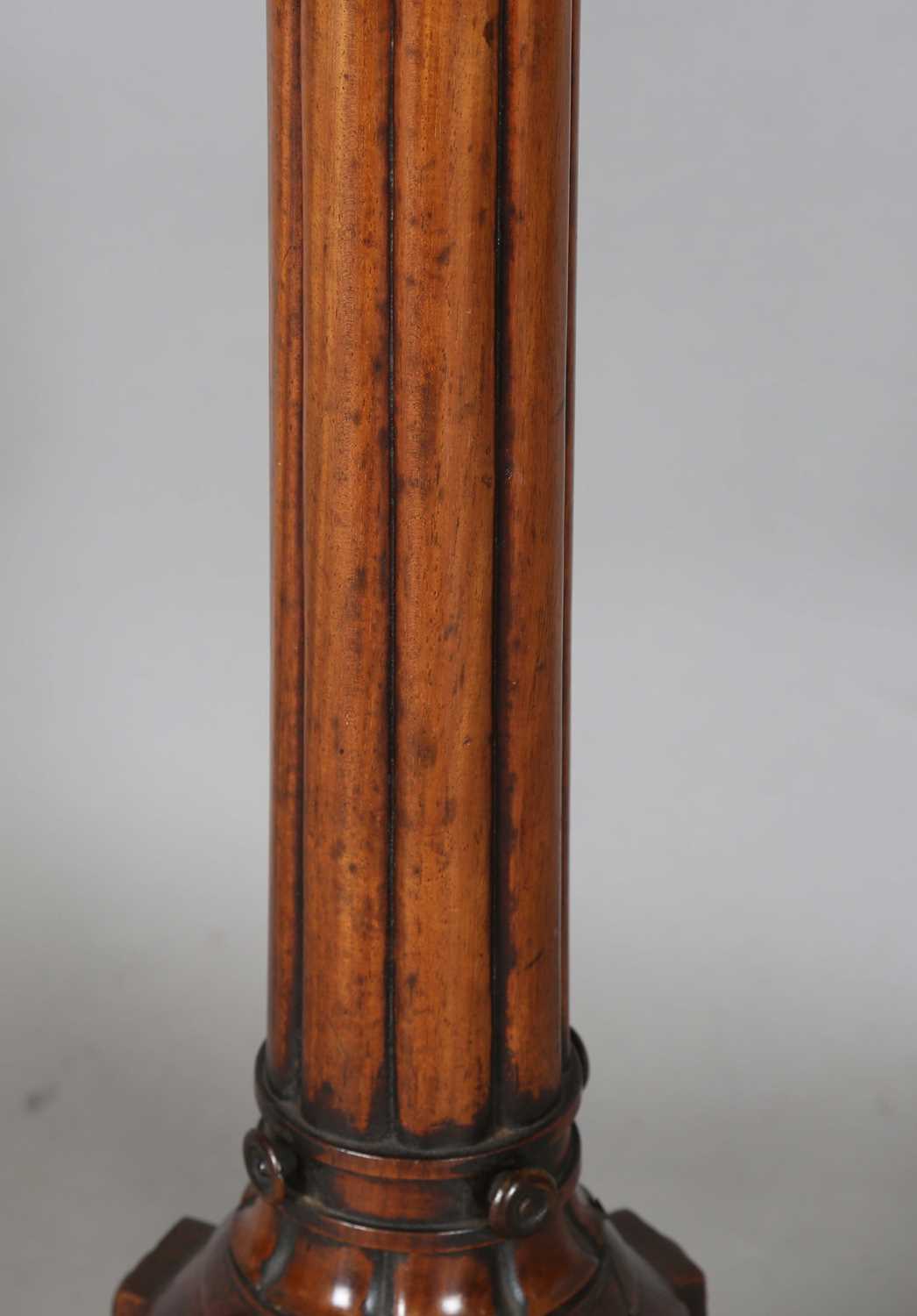 A William IV mahogany torchère, the top fitted with a brass tray above a reeded stem and triform - Image 6 of 9