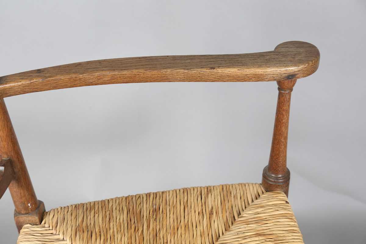 An Edwardian Arts and Crafts oak framed elbow chair, in the manner of William Birch, height 107cm, - Image 6 of 8