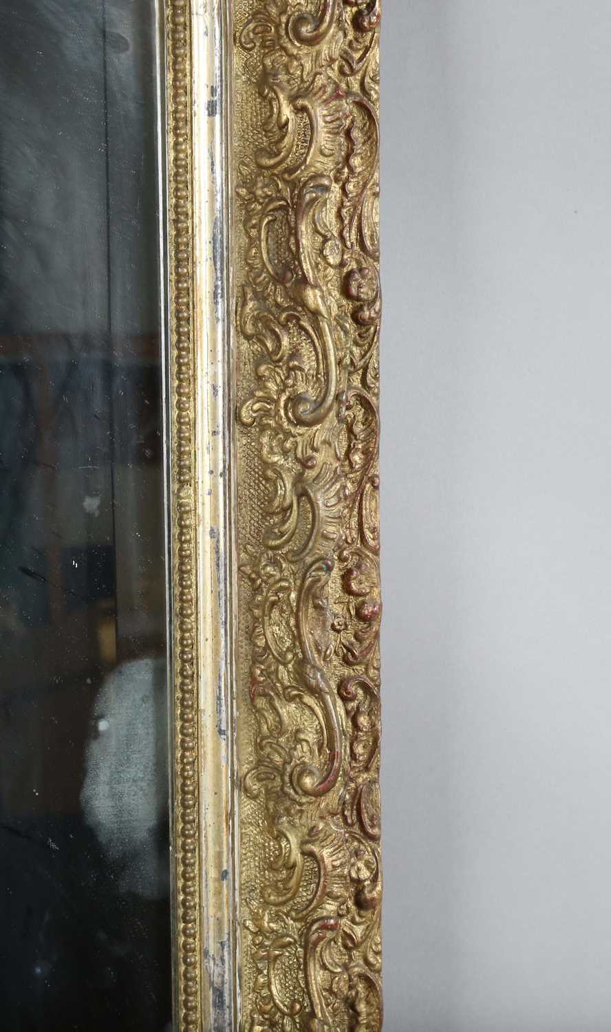 A late 19th century gilt composition arched overmantel mirror with a foliate scroll surmount and - Image 5 of 15