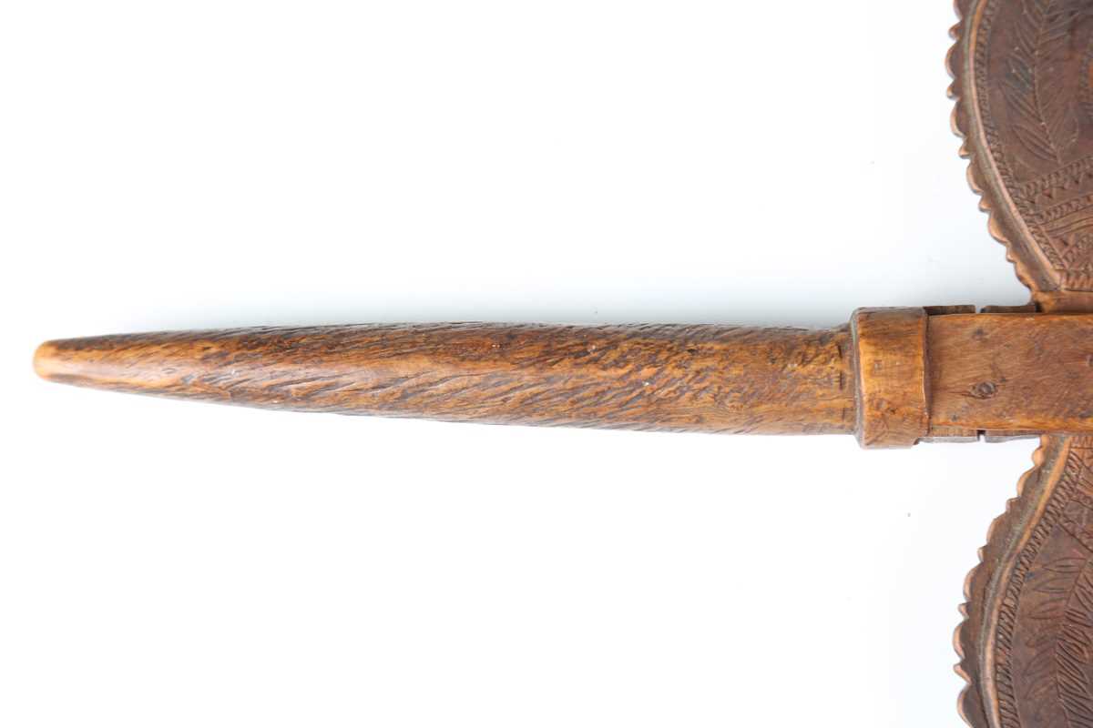 A 19th century patinated treen distaff, probably Greek, the shaped crosspiece finely incised with - Image 4 of 12