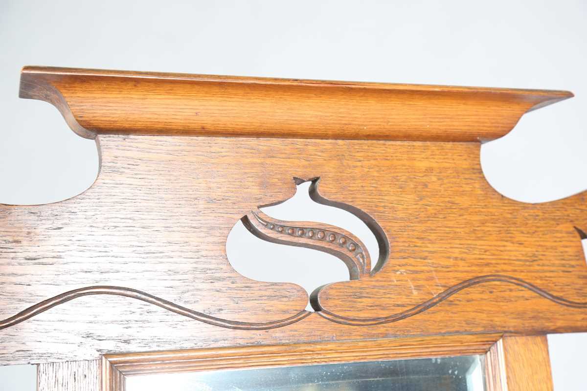An Edwardian Arts and Crafts oak hallstand, the pediment pierced with stylized tulips, height - Image 3 of 15