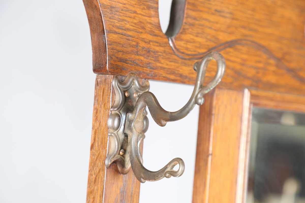 An Edwardian Arts and Crafts oak hallstand, the pediment pierced with stylized tulips, height - Image 5 of 15