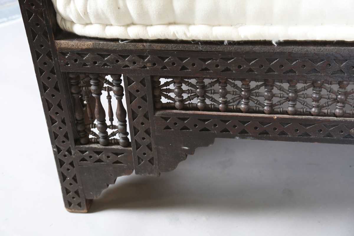 An early 20th century Middle Eastern softwood daybed, similar to those retailed by Liberty & Co, - Image 7 of 15