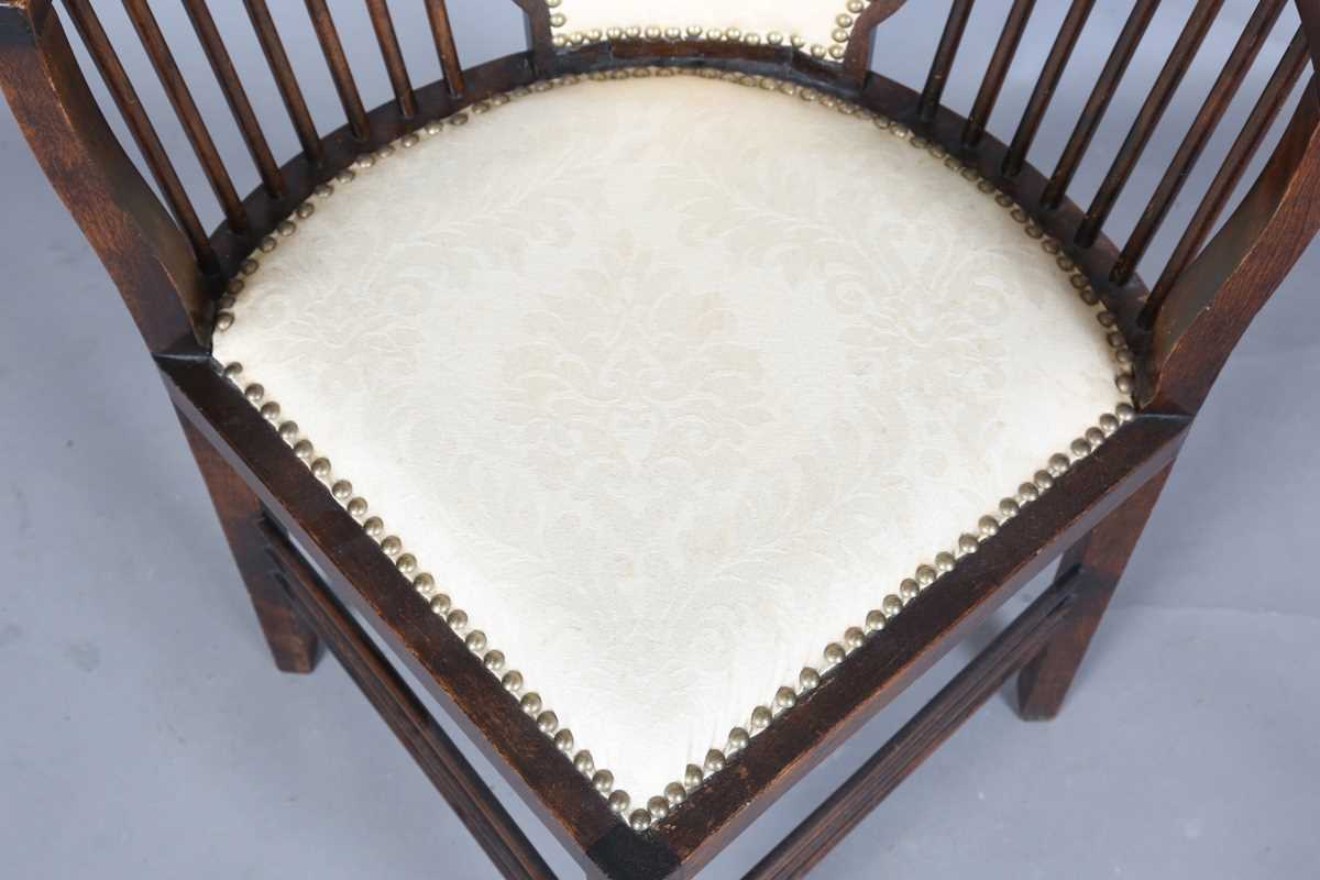 An Edwardian Arts and Crafts style stained walnut showframe armchair, upholstered in cream fabric, - Image 5 of 17