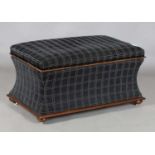 A Victorian mahogany framed rectangular ottoman with hinged lid and concave sides, raised on cup